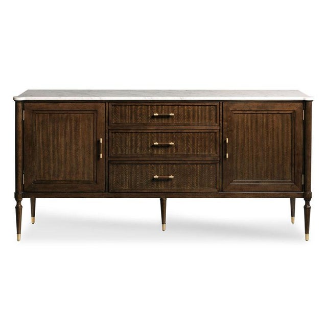 A handsome sideboard styled in the spirit of late 18th Century French Directoire originals with turned round corner posts...