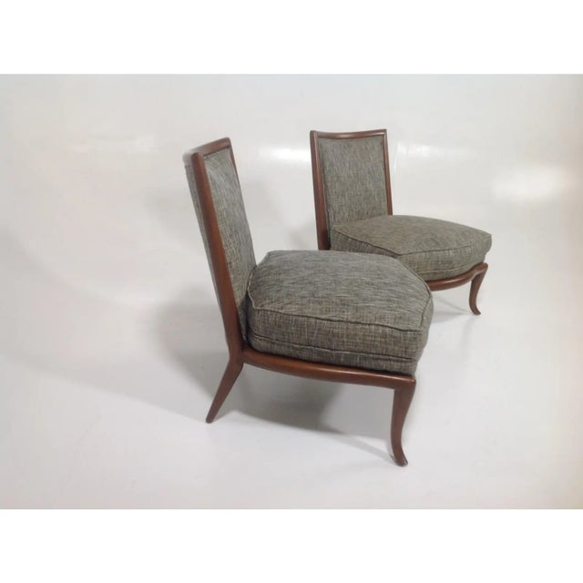 Modern slipper lounge chairs. The set is new, and in the manner of Robsjohn Gibbings. Feature walnut frames and gray...