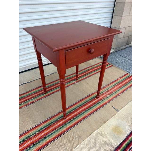 A Pennsylvania Turned Leg Red Wash Painted 1 Drawer Side Table, Circa 1840’s This exceptional piece of classic early...