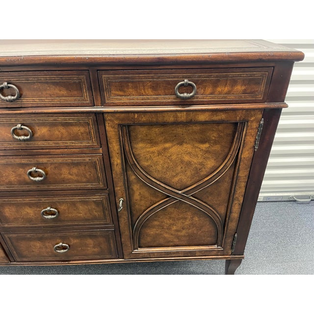 Elegant and substantial sideboard from the renowned luxury maker Theodore Alexander, part of the Villa Olmo Collection,...