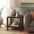 Enhance your living space with the Omara 1 Shelf Side Table in Walnut. Crafted with wood, this piece showcases a rich...