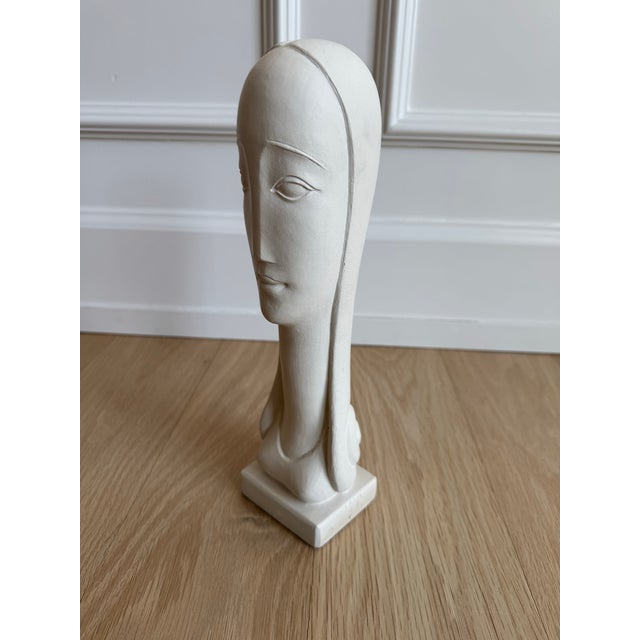 A refined mid-century modernist bust by American sculptor Rima Padova, signed and copyright marked “© Rima NY” on the...