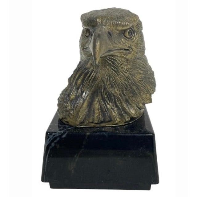 This sculptural eagle head is beautifully modeled with deeply worked feathers, a strong hooked beak, and an expressive,...