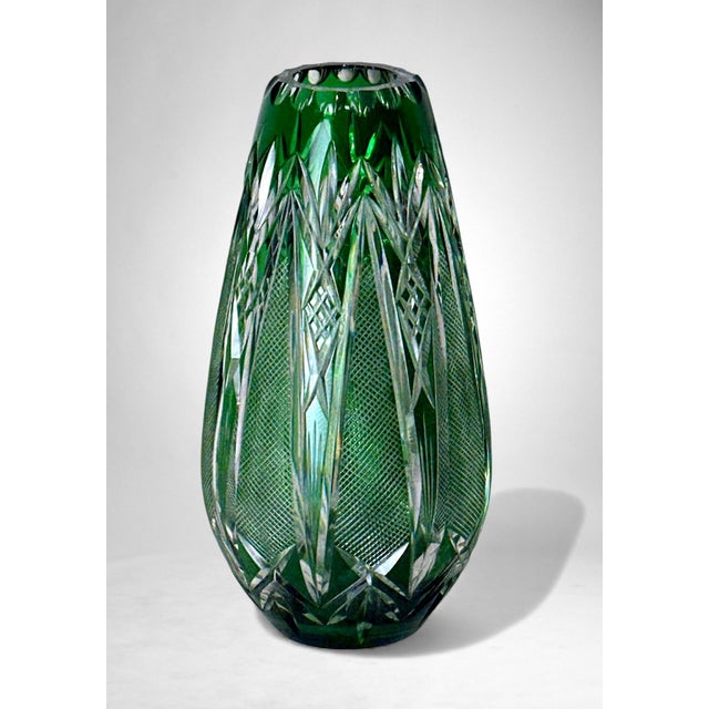Elegant and substantial green crystal vase, produced between 1950 and 1955 in Northern Bohemia, in the Jablonec nad Nisou...