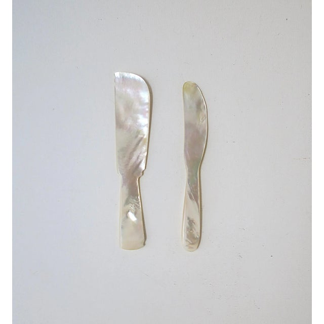 A set of two (2) Mother of Pearl caviar knife spreaders. A set for caviar or other gourmet cuisine.