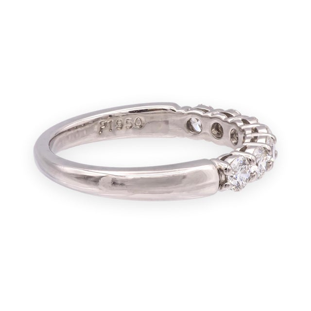 A platinum half-circle diamond band from Tiffany's Forever collection, set with seven round brilliant diamonds totaling...