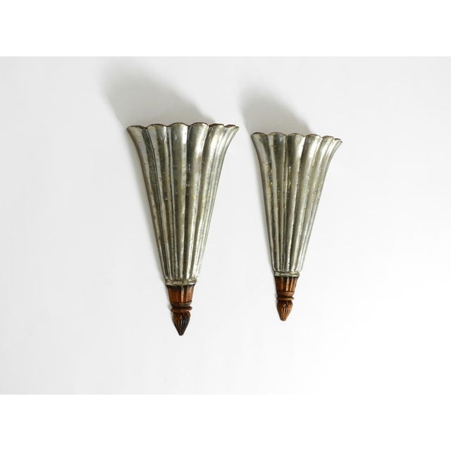 Set of two beautiful, long, triangular wall lamps from the 1950s, made of wood. Great design with many lovely details....