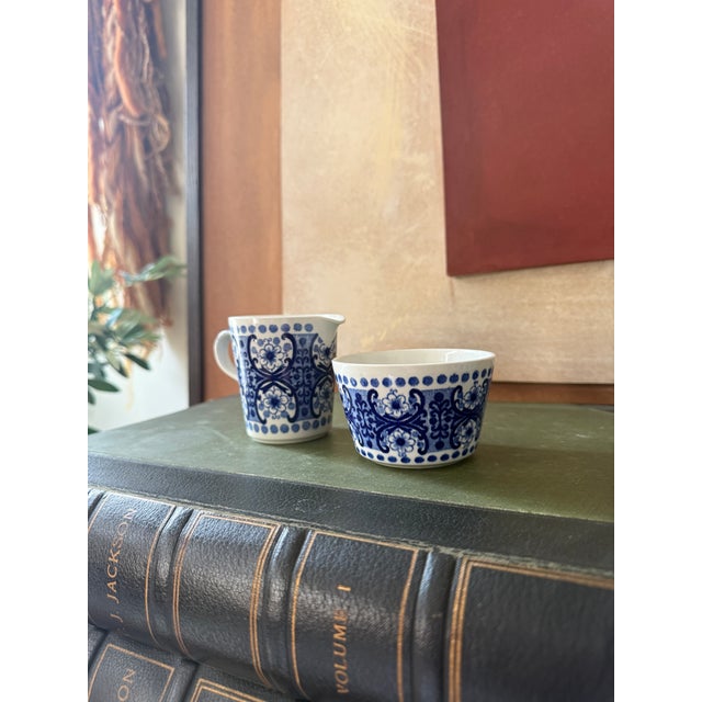 This vintage Arabia Finland Ali Blue creamer and sugar bowl set features the intricate cobalt blue and white floral...