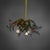 Three-light brass ceiling lamp in the shape of a holly branch. A horizontally spreading wreath of curved branches extends...