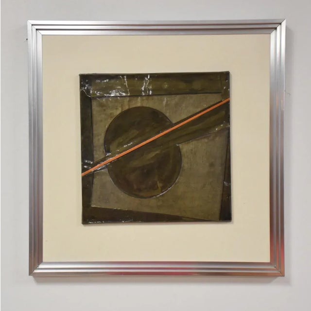 This tin three dimensional abstract printed piece is signed and dated '76.