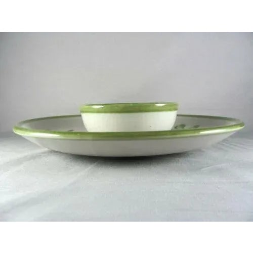 No chips nor cracks nor crazing nor staining Colors and glossy glaze are vibrant and crisp Discolored scuff/utensil marks...