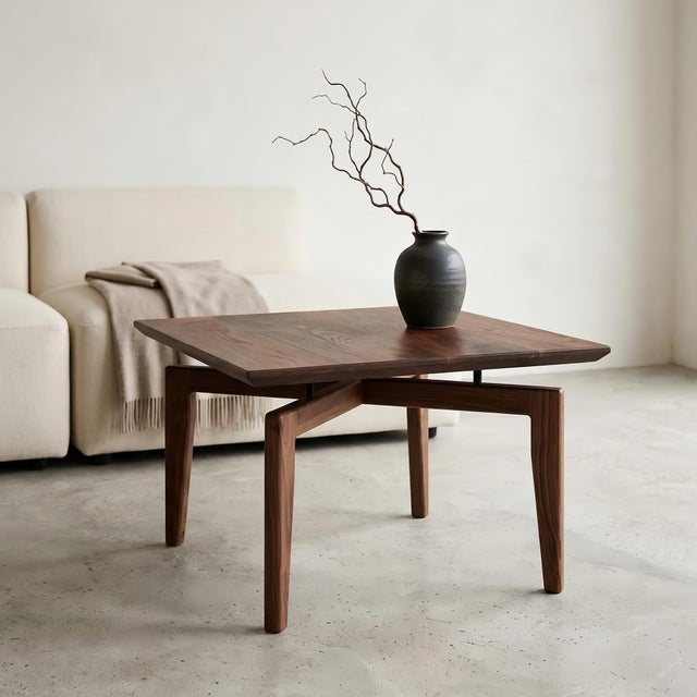 MERIDAR is a handmade solid black walnut coffee table designed for living rooms, reading corners, studios, bedrooms, and...