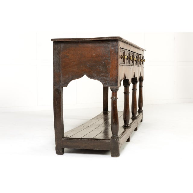An 18th century montgomeryshire oak dresser base. having an excellent colour and a rich, well-developed patination. The...