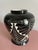 Striking black-and-white ceramic vase. Signed “Curras ’96,” Curras Brothers of Miami. The glossy black surface is...