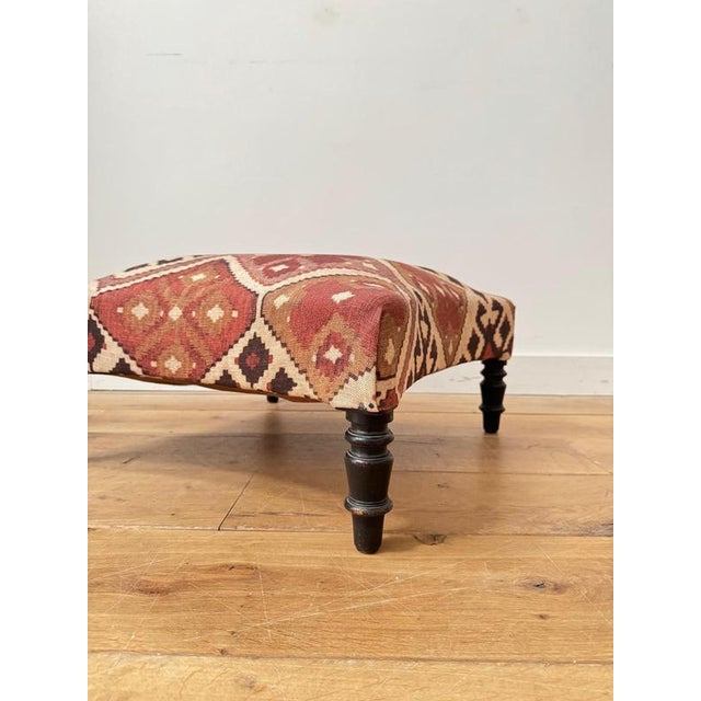 A lovely 19th century French footstool. Newly recovered in kilim printed fabric, and in excellent condition. Measurements:...