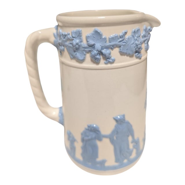Elevate your tabletop styling or ceramics collection with this authentic mid-century Wedgwood Embossed Queen's Ware jug....