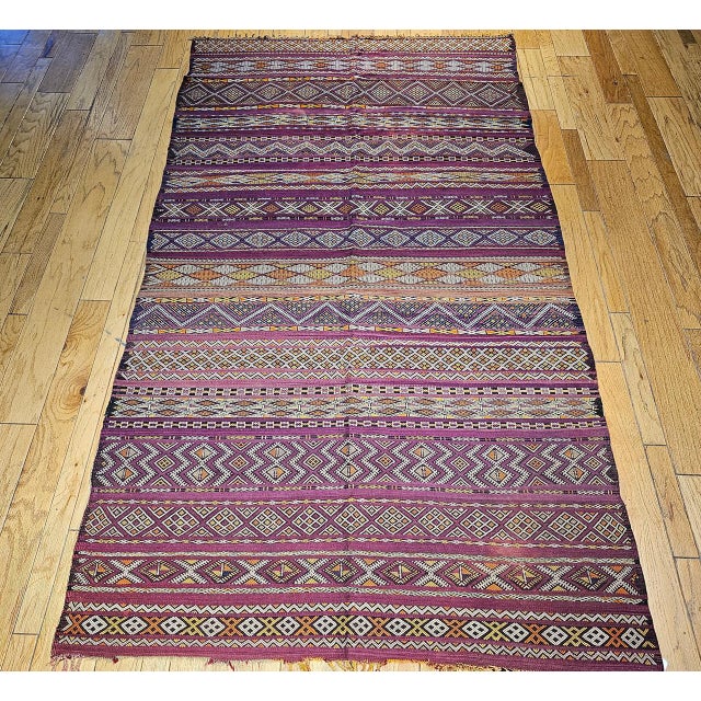 Few vintage Moroccan kilims inspire as immediate a double-take as this mid-20th century example — its palette of deep...