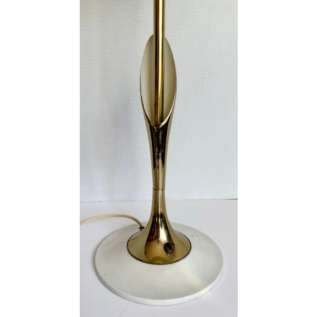 This design-forward mid-century modern table lamp, attributed to Laurel Lamp Company, was likely produced in the...