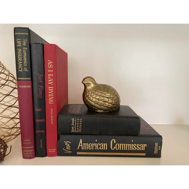 Add color and interest to your shelf or coffee table with this eclectic collection of vintage books in Black and Red....
