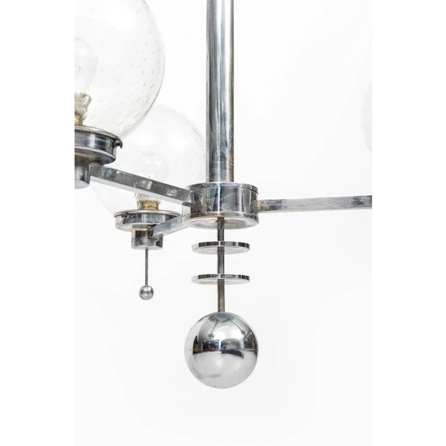 A pair of big Art Deco ceiling lamps in chromed steel and glass bowls. Probably produced in Sweden. Up to 250V (Europe/UK...