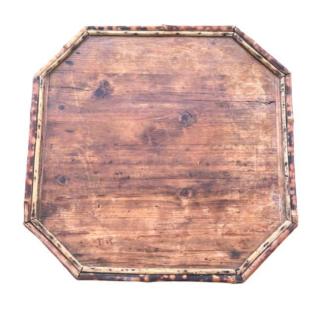 A lovely antique octoganol side table constructed of burnt or tortoise shell bamboo. Dating from the mid-late 19th...
