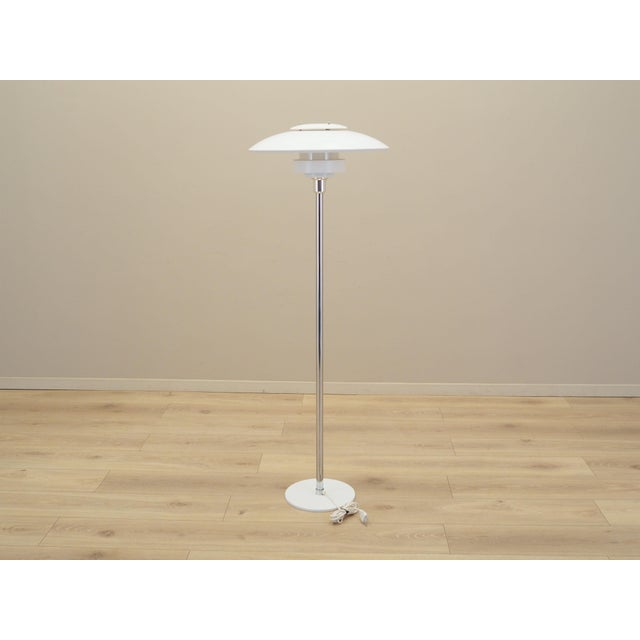 The lamp was made in the 1970s, designed by the well-known Danish designer Simon Henningsen for the Lyskaer manufactory....