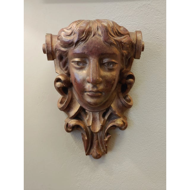 Here's a lovely antique plaster sculptural wall mount that features a stylized Arte Nouveau woman's head. The gold paint...