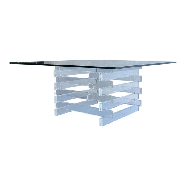 Very stylish thick stacked lucite coffee table from the 1970s with nice original glass top glass is 36”x36”
