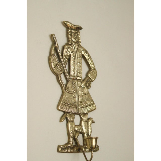 Made in Denmark A breathtaking mid-century duo of exquisite brass wall sconces, showcasing exquisite Folk Art. Both...