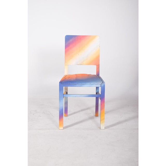 Painted dining chair. With simple lines, it has been updated with contemporary paint in gradient tones that evoke a...