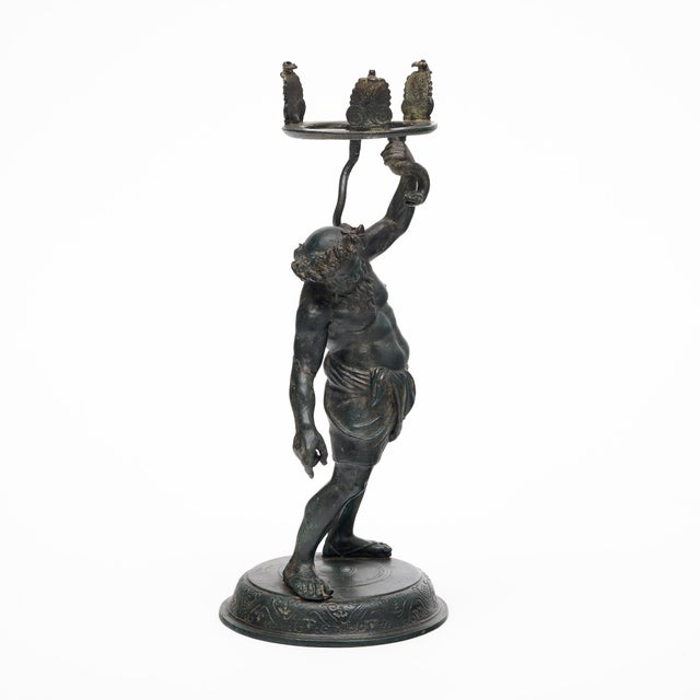 Antique bronze sculpture of Silenus from Greek mythology. Silenus was the companion and tutor to the wine god, Dionysus....