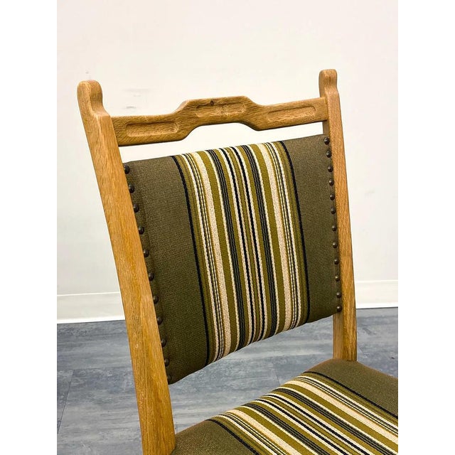 A fine set of 4 carved / figured oak Danish dining chairs. The chairs are upholstered in a quality striped, wool based,...