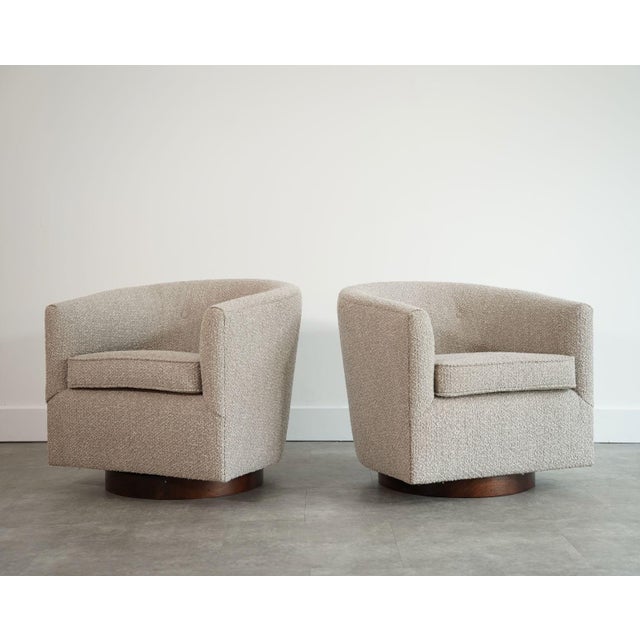 An exceptional pair of swivel lounge chairs designed by Edward Wormley for Dunbar, circa 1950s. Showcasing Wormley’s...