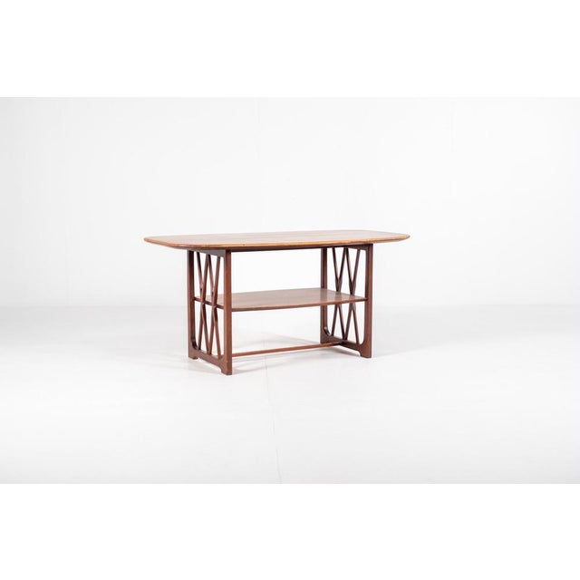 A striking wooden coffee table designed by a.a. Patijn for zijlstra joure in the 1950s, most likely part of the poly z...