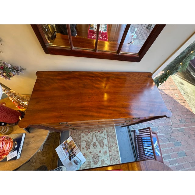 This is a 19th century antique Birdseye maple chest of drawers. It has four drawers. The handles are brass. It is Sheraton...