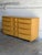 This vintage bedroom credenza features a streamlined multi-drawer layout highlighted by an iconic stepped configuration...