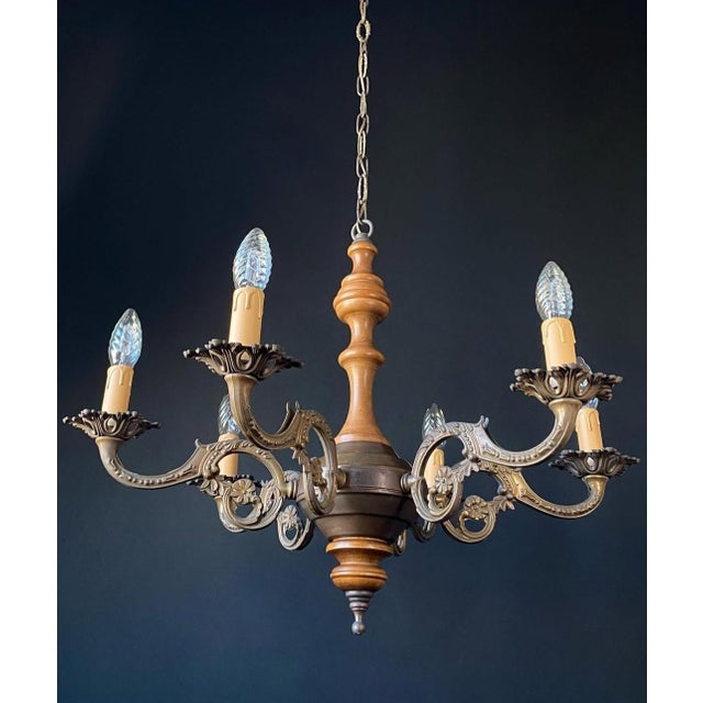 The chandelier is made of brass - beautiful artistic forging. Decorated with wooden elements. Dimensions of the...