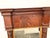 An antique trumeau mirror with an intricate, mahogany frame. Historically designed to be placed between windows or above a...
