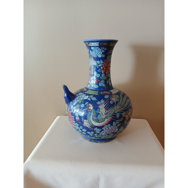 Unique and rare Asian enamel painted ceramic vase with spout. Blue feather mark on the bottom. Great shape for its age....