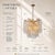 Bring natural elegance to your home with this 11-light branch chandelier. Featuring cascading clear glass leaves and a...