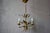 Like a wildflower bouquet suspended in mid-air, this charming vintage chandelier from the 1970s brings a touch of golden...