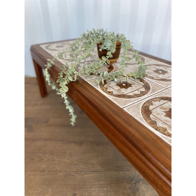 A refined mid-century modern coffee table by g plan, dating from the 1960s and crafted in beautifully grained teak. The...