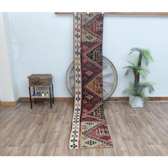 Vintage Turkish Hand-Knotted Kilim rug is a semi-antique vintage area rug. The '70s Eastern region of Anatolian's unique...