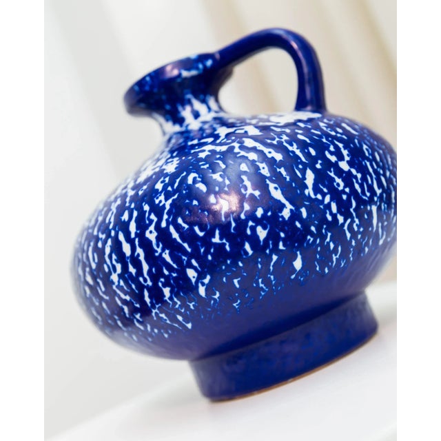 Shapely vintage vase by Veb Handelsleben. The ceramic jug with Fatlava-like spray glaze fits perfectly into the mid-...