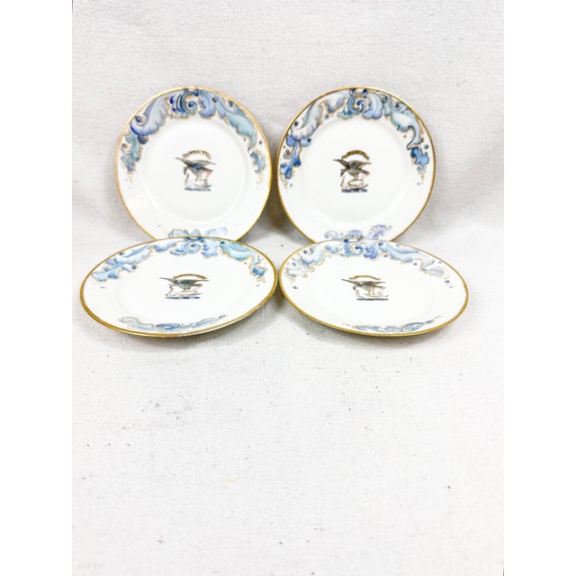 A striking and exceptionally rare set of four (4) antique French porcelain plates. Featuring a beautifully rendered...