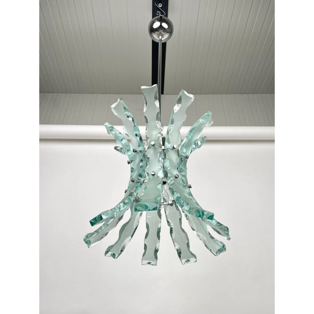Curved art glass and steel chandelier pendant by o4 (zero quattro) edited by fontana arte, milano, italy in the 1970s. The...