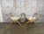A magnificent pair of Italian Neoclassical curule stools, embodying timeless grandeur and Hollywood Regency glamour. This...