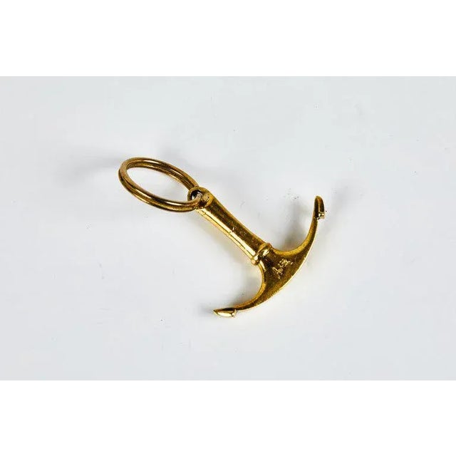 Carl Auböck Model #7151 brass figurine keyring. Designed in the 1950s, this incredibly refined and sculptural object is...