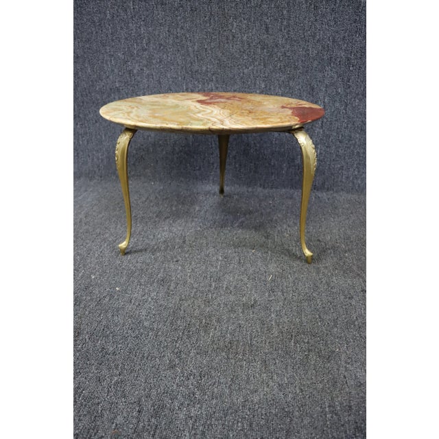 Onyx coffee table with gilded metal legs