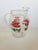 A beautiful mid century red rose glass pitcher measuring 9 ½” h x 8” d x 4” base. Perfect for summer or holiday dining!!